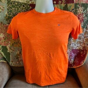 Old Navy Active youth shirt in large. Bright orange with blue accent. Go-Dry.